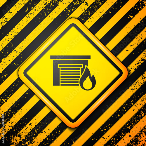 Black Fire in burning garage icon isolated on yellow background. Warning sign. Vector