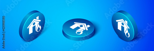 Isometric Fire in burning house icon isolated on blue background. Blue circle button. Vector