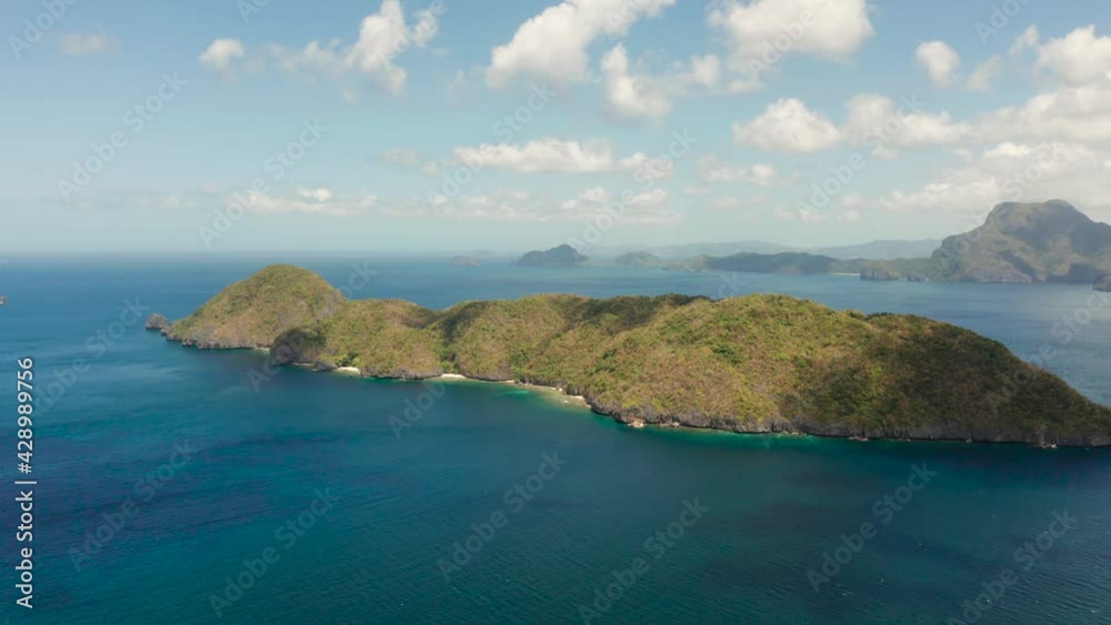 aerial view of Seascape with tropical island, blue water. islands and mountains covered with tropical forest. El nido, Philippines, Palawan