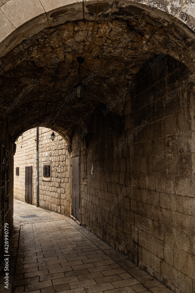 Mysterious narrow street in the old town of Kotor, Montenegro.