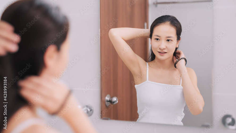 Girl taking care refreshing her hairstyle. Haircare concept. Girl taking care refreshing her hairstyle. Haircare concept.