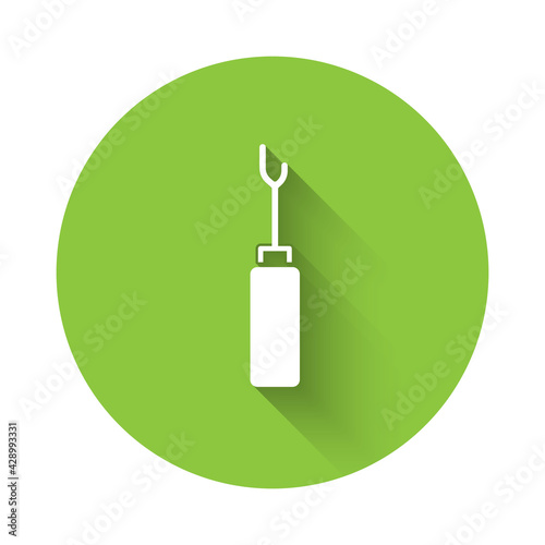 White Awl tool with wooden handle icon isolated with long shadow. Work equipment tailor industry. Green circle button. Vector
