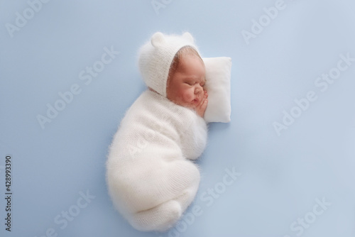 Newborn baby boy sleep on blue blanket. Cute sleeping newborn
