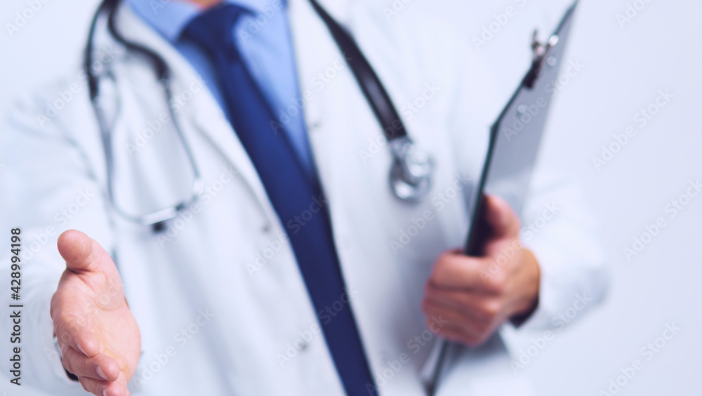 Friendly male doctor with open hand ready for hugging Friendly male doctor with open hand ready for hugging