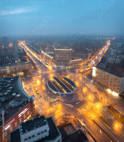 Wroclaw, Poland. Aerial view of Plac Grunwaldzki square at dusk with public transport hub in the middle