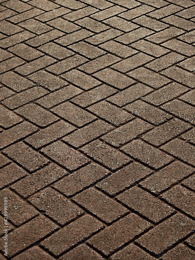 old zigzag stone block floor of walkway texture