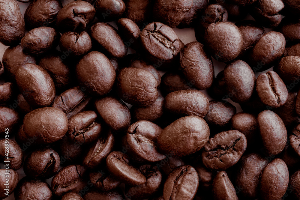 Coffee beans. Coffee beans are spread out on the surface. Coffee beans. Coffee beans are spread out on the surface.