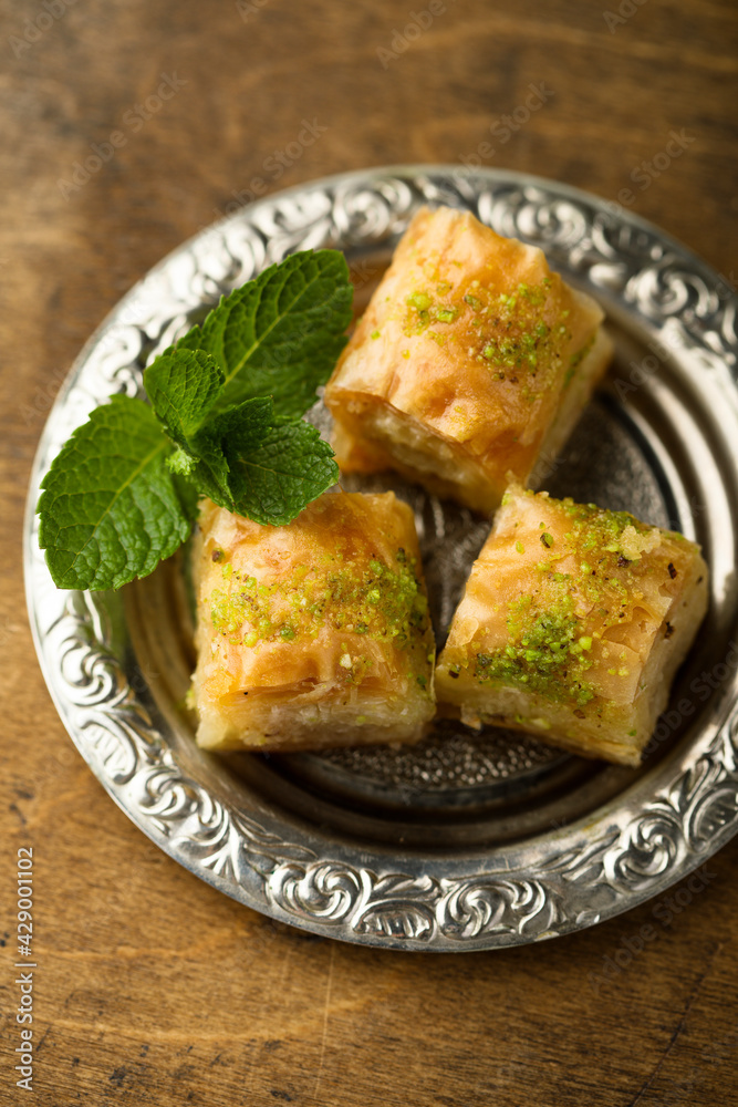 Traditional homemade Turkish baklava with pistachios Traditional homemade Turkish baklava with pistachios