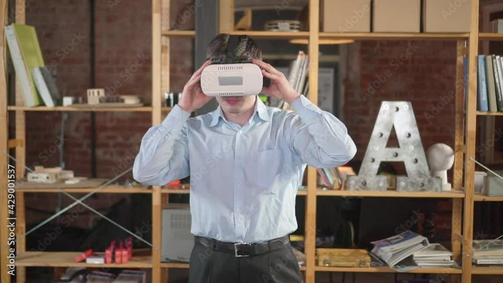 A guy European wears virtual reality glasses A guy European wears virtual reality glasses