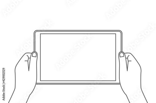 man holds a tablet in his hands. blank screen with place for your text.