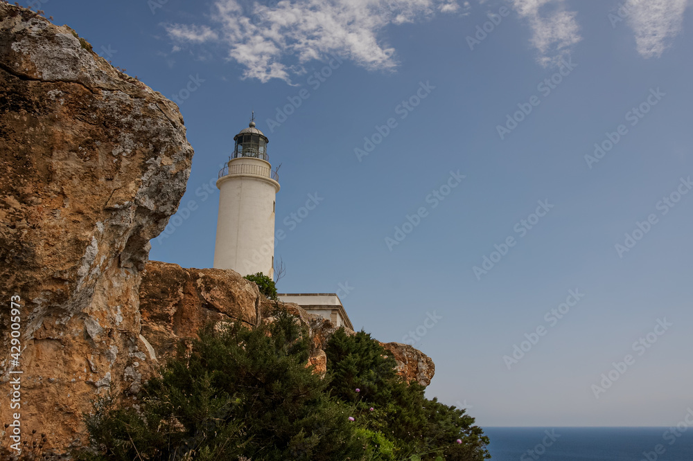 white lighthouse at the coast