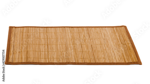Bamboo straw serving mat isolated over white background.