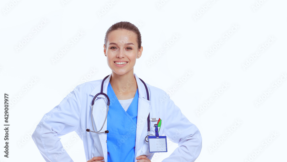 Beautiful young woman in white coat posing with hand in pocket. Woman doctor Beautiful young woman in white coat posing with hand in pocket. Woman doctor
