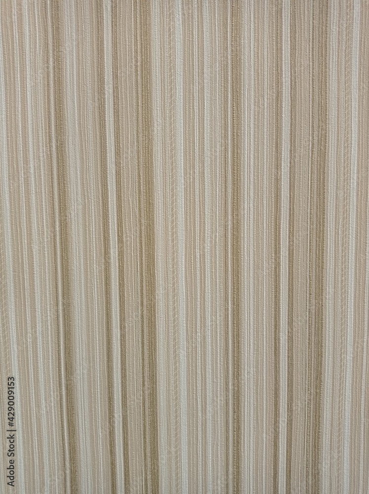Obraz premium Background with vertical stripes of different widths in yellow-green shades. Wallpaper