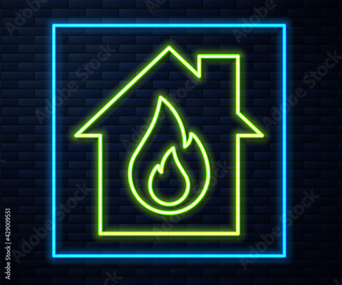 Glowing neon line Fire in burning house icon isolated on brick wall background. Vector photo