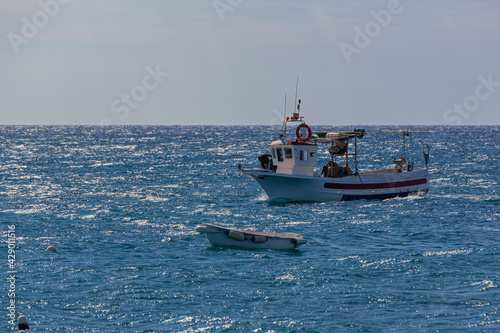 Fishboat comes back to the coast, Almeria, Spain.