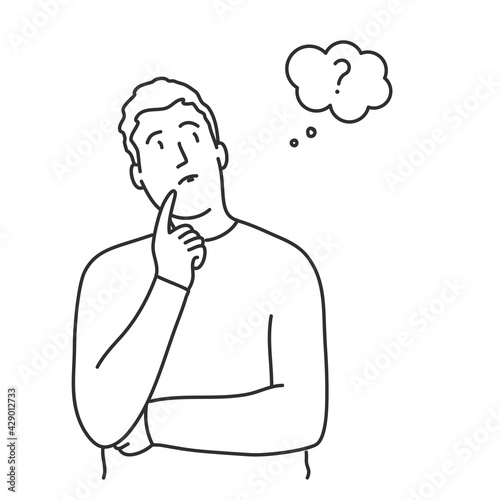 Young man standing in thoughtful pose