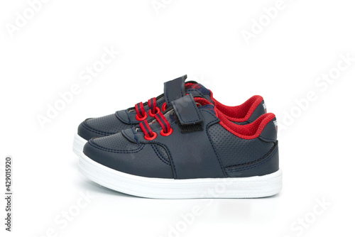 Chidren´s dark blue shoes isolated on the white background.