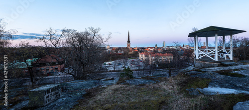 Sunset over the city. View of the Vasteras city skyline from viewpoint at public park. Photo taken in Vasteras, Sweden