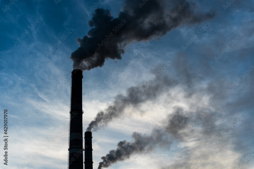 Smoking factory chimneys with co2 emissions.Environmental problem of environmental and air pollution.Climate change,ecology, global warming.The sky is smoky with toxic substances.Soot from factories Smoking factory chimneys with co2 emissions.Environmental problem of environmental and air pollution.Climate change,ecology, global warming.The sky is smoky with toxic substances.Soot from factories