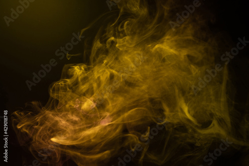 Yellow and pink steam on a black background.