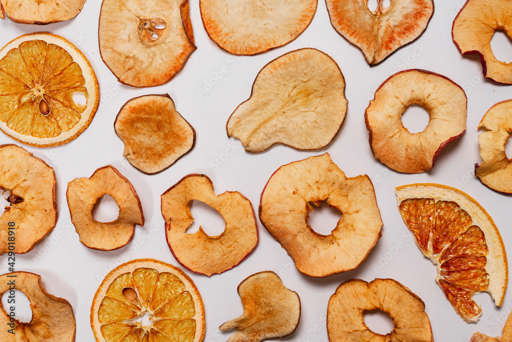Dried fruit isolated on white background. Dried grapefruit, dried apple, dried pear.