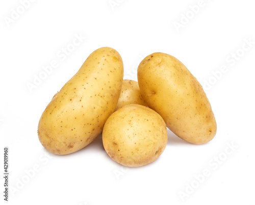 Pile of raw potatoes isolated on white background