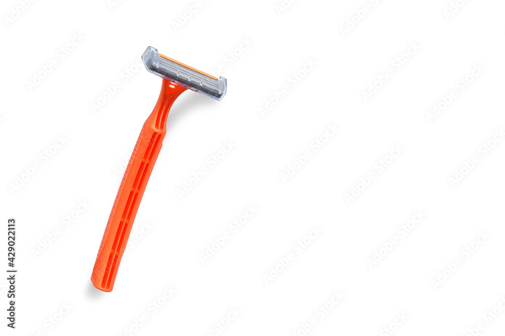Disposable shaving razor orange on white isolated background Disposable shaving razor orange on white isolated background