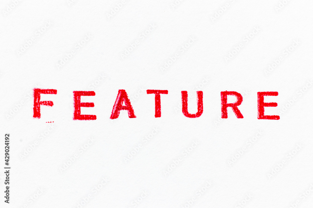 Fototapeta premium Red color ink rubber stamp in word feature on white paper background