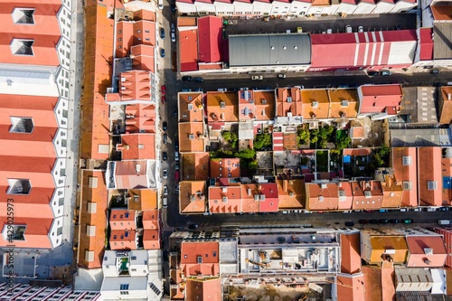Aerial view of a car on a small bridge crossing the railway in Marvila residential district in Lisbon outskirt, Portugal.