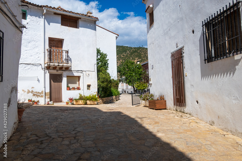 Typical streets of Sot de Chera adorned with beautiful colored flowerpots.