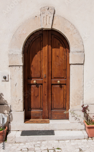 Old wooden italian door in a small village in Abruzzo