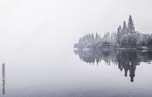 Foggy Morning at west lake in the most beautiful countryside in Hangzhou China  © Parichart