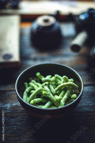 Closeup of green snack food in a bowl.