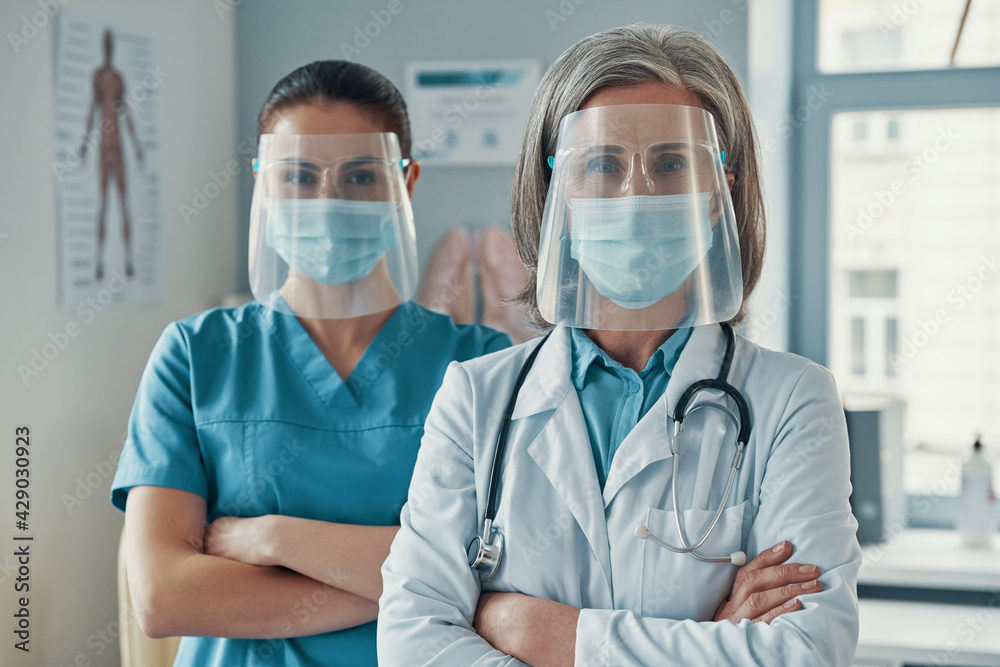 Two women coworkers in medical uniform Two women coworkers in medical uniform