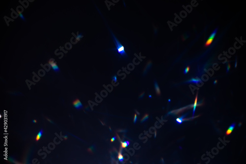 Slika na platnu Blur colorful warm rainbow crystal light leaks on black background