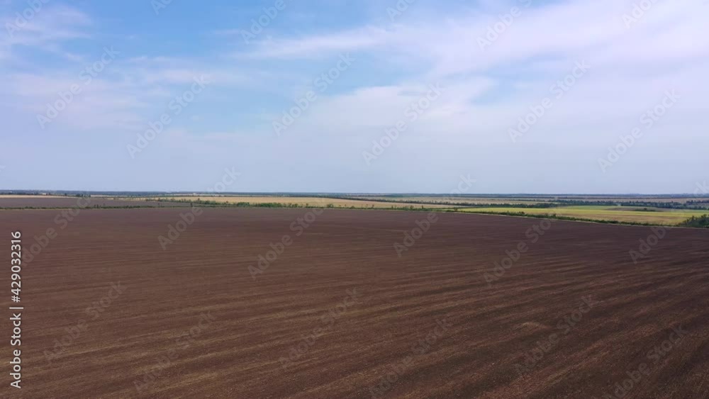 Arable fields and sunflower fields from a bird's eye view. Agricultural fields Arable fields and sunflower fields from a bird's eye view. Agricultural fields