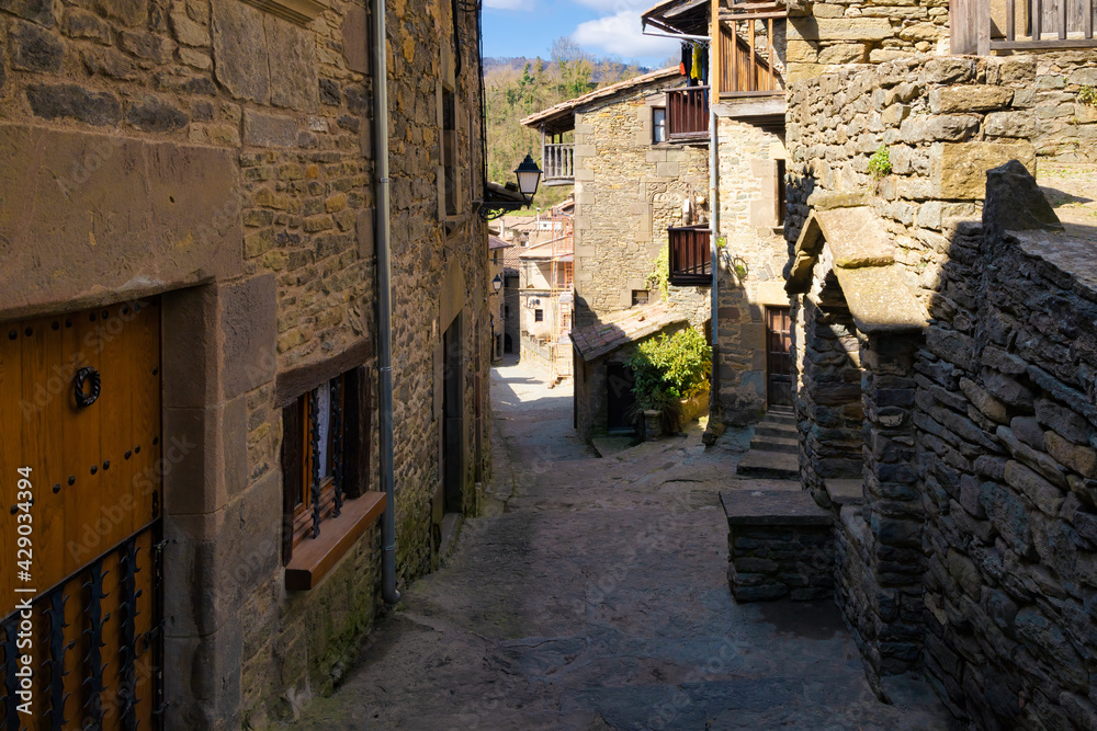 View of the Coll Castell street, one of the most typical streets of the medieval center of Rupit where all the houses have the aesthetics of the medieval centuries. Catalonia, Spain