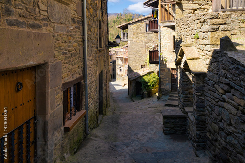 View of the Coll Castell street  one of the most typical streets of the medieval center of Rupit where all the houses have the aesthetics of the medieval centuries. Catalonia  Spain