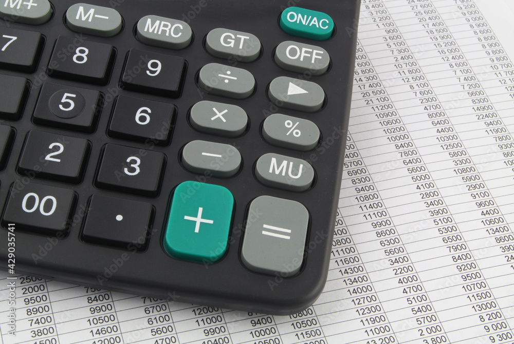 Business and counting concept. Calculator on report with financial data, many numbers in rows. Business and counting concept. Calculator on report with financial data, many numbers in rows.