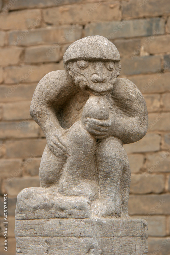 statue of a monkey (?) at the chang family mansion in pingyao in china 