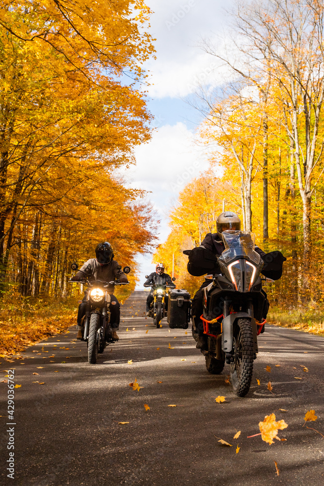 Group of friends riding motorcycles in the fall in Canada