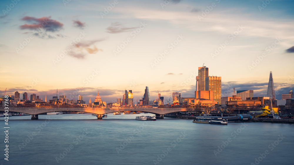 London cityscape along river Thames at dusk, England, UK
