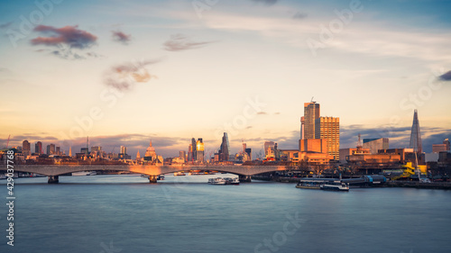 London cityscape along river Thames at dusk, England, UK