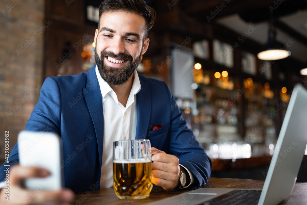 Young business man having a break in a restaurant. Work occupation business lifestyle concept Young business man having a break in a restaurant. Work occupation business lifestyle concept