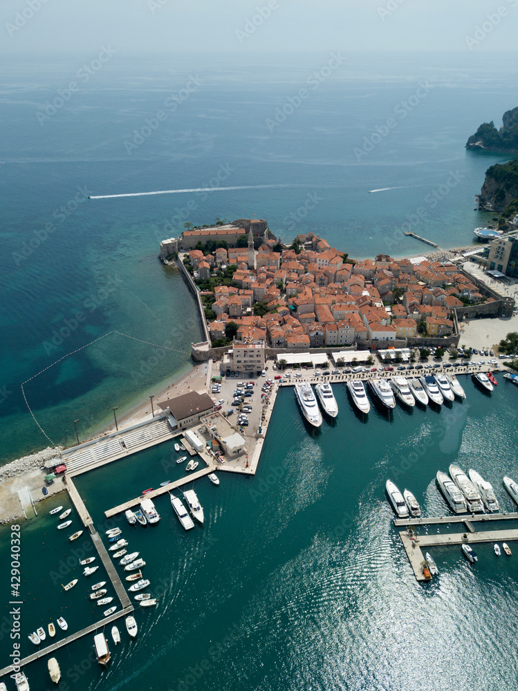 Φωτογραφία Aerial view of old town, boats moored in dock, yacht port in Budva, Montenegro