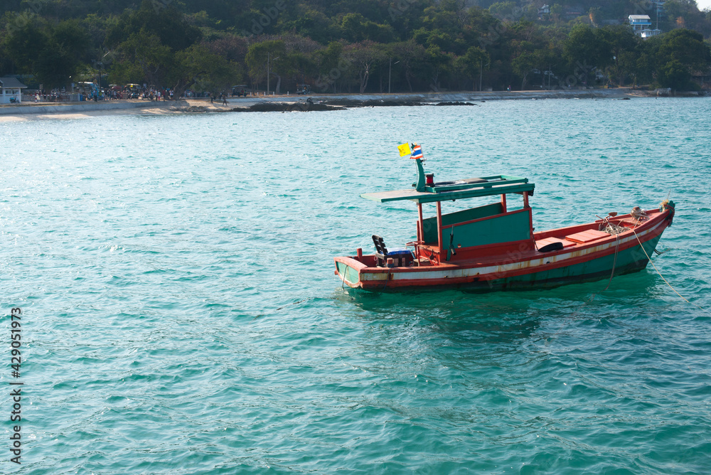 small colorful boat floating on the sea