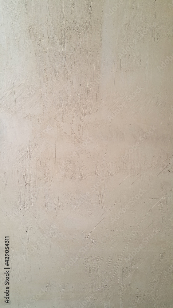 The plastered wall is gray. The wall inside the room. Background picture with scratches. Architecture and construction. Interior design. Copy space for text.