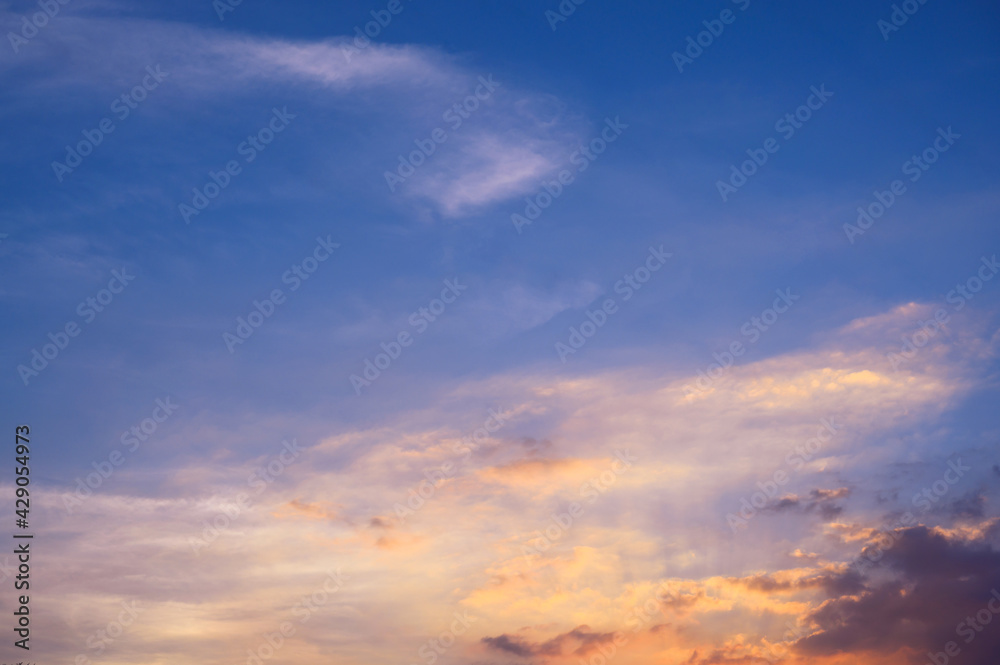Sunbeams breaking through the clouds with blue and orange sky. Hope, prayer concept for background.