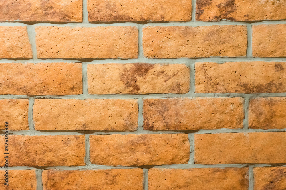 Obraz premium Orange bricks on the wall texture and background